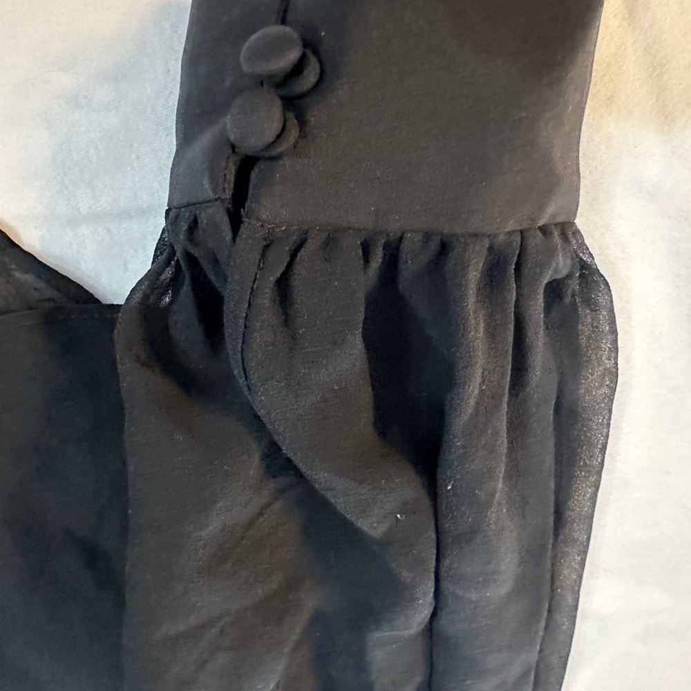Beautiful gauze top with under layer  great for the office in summer !